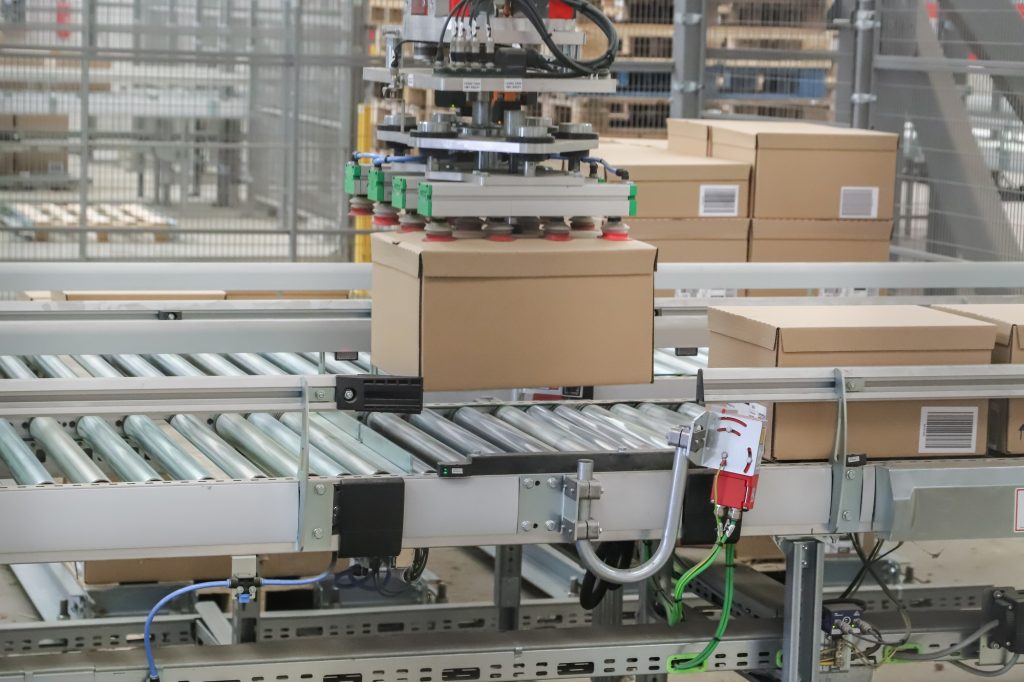 packing line in a logistics warehouse. conveyor belt in a modern production line